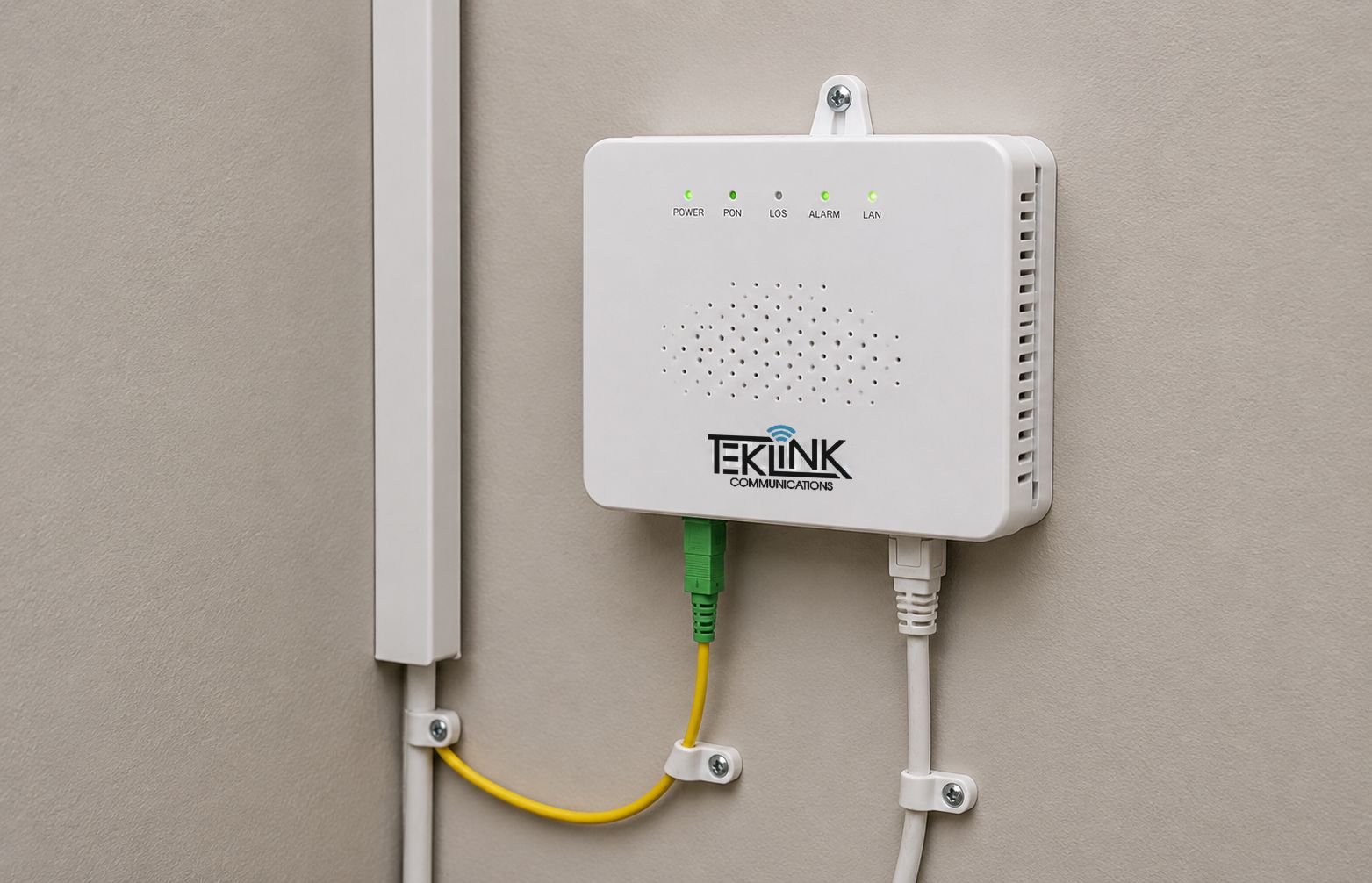 Interior install detail: ONT mounted clean on a wall with cable dressed and secured, no slack loops hanging.